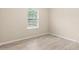 Bedroom with neutral walls, wood-look flooring and natural light at 7001 Interbay Blvd # 242, Tampa, FL 33616