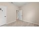 Neutral bedroom with wood-look flooring and a view into the hallway at 7001 Interbay Blvd # 242, Tampa, FL 33616