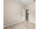 Neutral bedroom with wood-look floors and a white door to hallway at 7001 Interbay Blvd # 242, Tampa, FL 33616