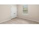 Bedroom with window, closet, and wood-look floors at 7001 Interbay Blvd # 242, Tampa, FL 33616