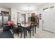 Casual dining area with table, chairs, and view to the home's entry door at 7001 Interbay Blvd # 242, Tampa, FL 33616