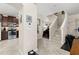 Open-concept entryway featuring a staircase, view of the kitchen, and a doorway to an office at 7001 Interbay Blvd # 242, Tampa, FL 33616