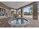 Inviting in-ground hot tub under a covered patio, perfect for relaxing evenings at 7001 Interbay Blvd # 242, Tampa, FL 33616