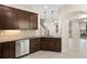 Kitchen sink and counter with stainless steel dishwasher and backyard view at 7001 Interbay Blvd # 242, Tampa, FL 33616