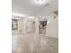 Open-concept living room with tile flooring, modern lighting, and staircase at 7001 Interbay Blvd # 242, Tampa, FL 33616