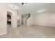 Open concept living space featuring tiled floors and staircase to the second story at 7001 Interbay Blvd # 242, Tampa, FL 33616