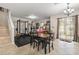 View of the living room, dining area, and exercise equipment space, with natural light at 7001 Interbay Blvd # 242, Tampa, FL 33616