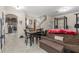 Living room featuring a dining area, stairs, kitchen view, and exercise equipment area at 7001 Interbay Blvd # 242, Tampa, FL 33616