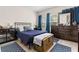 Comfortable main bedroom featuring carpet, windows, and nice furniture at 7001 Interbay Blvd # 242, Tampa, FL 33616