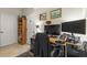 A functional home office featuring a desk, shelving, and artwork at 7001 Interbay Blvd # 242, Tampa, FL 33616