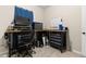 Well-lit office featuring an adjustable desk, rolling chair and mechanic tool chests at 7001 Interbay Blvd # 242, Tampa, FL 33616