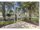 Relaxing screened porch overlooking well-maintained landscaping and mature trees at 7001 Interbay Blvd # 242, Tampa, FL 33616
