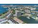 Captivating aerial shot displays a condo building nestled beside a tranquil waterway and lush landscaping at 7300 Sun Island S Dr # 1505, South Pasadena, FL 33707
