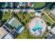 Aerial view showcasing a waterfront community with a pool, shuffleboard courts and boat docks at 7300 Sun Island S Dr # 1505, South Pasadena, FL 33707