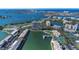 Breathtaking aerial view of the condo building, tennis court, boat parking, and beautiful waterway at 7300 Sun Island S Dr # 1505, South Pasadena, FL 33707