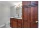 Bathroom with custom wood cabinets, granite countertop, and a modern sink at 7300 Sun Island S Dr # 1505, South Pasadena, FL 33707
