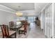 An elegant dining room area features chandelier and blends to the living area with views at 7300 Sun Island S Dr # 1505, South Pasadena, FL 33707