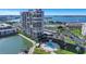 Beautiful view of condo building with pool, waterway, and covered parking at 7300 Sun Island S Dr # 1505, South Pasadena, FL 33707