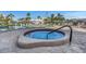 Inviting hot tub surrounded by pavers, with a steel support rail at 7300 Sun Island S Dr # 1505, South Pasadena, FL 33707