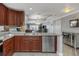 Open kitchen with stainless steel appliances, granite counters, and flows seamlessly to the dining area at 7300 Sun Island S Dr # 1505, South Pasadena, FL 33707