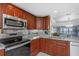 The kitchen features stainless steel appliances, granite countertops, and seamless flow to the living area at 7300 Sun Island S Dr # 1505, South Pasadena, FL 33707