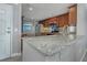 Well-equipped kitchen features granite counters, stainless appliances, and ample cabinet storage at 7300 Sun Island S Dr # 1505, South Pasadena, FL 33707