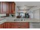 The open-concept kitchen boasts granite countertops, stainless appliances, and a seamless flow to the living area at 7300 Sun Island S Dr # 1505, South Pasadena, FL 33707