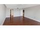 Bright living room with hardwood floors, neutral walls, and a ceiling fan at 7300 Sun Island S Dr # 1505, South Pasadena, FL 33707