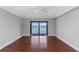 Living room with hardwood floors leading to balcony and featuring a water view at 7300 Sun Island S Dr # 1505, South Pasadena, FL 33707