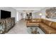 Open-concept living room and dining area with comfortable seating and stylish decor for modern living at 7300 Sun Island S Dr # 1505, South Pasadena, FL 33707