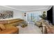 Living room with water view, comfortable seating and stylish decor, perfect for relaxing or entertaining guests at 7300 Sun Island S Dr # 1505, South Pasadena, FL 33707
