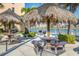 Community picnic area with tiki huts, grills, and tables overlooking the waterfront at 7300 Sun Island S Dr # 1505, South Pasadena, FL 33707