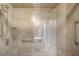 Bright tiled shower features clear glass, grab bars, shelving and a showerhead at 7300 Sun Island S Dr # 1505, South Pasadena, FL 33707