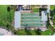 Aerial view of shuffleboard courts with covered seating areas surrounded by green landscaping at 7300 Sun Island S Dr # 1505, South Pasadena, FL 33707