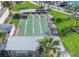Aerial view of shuffleboard courts with covered seating areas surrounded by green landscaping at 7300 Sun Island S Dr # 1505, South Pasadena, FL 33707