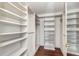 Walk-in closet with hardwood floors and a shelving system for optimal storage at 7300 Sun Island S Dr # 1505, South Pasadena, FL 33707