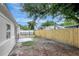 A spacious backyard with a wood fence at 7524 Tidewater Trl, Tampa, FL 33619