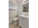 A bathroom with neutral colors and tile at 7524 Tidewater Trl, Tampa, FL 33619