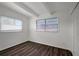 This bedroom features bright white walls, a closet, and dark brown wood flooring at 7524 Tidewater Trl, Tampa, FL 33619
