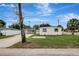 Home exterior with a well maintained lawn and an ample driveway at 7524 Tidewater Trl, Tampa, FL 33619