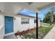 Exterior view of a home highlighting the bright blue front door at 7524 Tidewater Trl, Tampa, FL 33619
