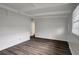 Bright, airy living room with hardwood floors and fresh white paint at 7524 Tidewater Trl, Tampa, FL 33619