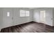 Bright living room with hardwood floors and ample natural light at 7524 Tidewater Trl, Tampa, FL 33619