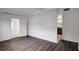 Spacious living room with hardwood floors that flows into kitchen at 7524 Tidewater Trl, Tampa, FL 33619