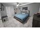 This primary bedroom features a lighted headboard, ceiling fan, and marble floors at 8341 41St N Ave, St Petersburg, FL 33709