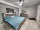 This well lit bedroom features cool gray walls, marble floors, and a sleek modern bed at 8341 41St N Ave, St Petersburg, FL 33709