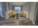 Bright dining room features a glass table, four chairs, grey walls, and white wainscoting at 8341 41St N Ave, St Petersburg, FL 33709