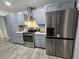 Well-equipped kitchen with stainless steel appliances, gray cabinetry, and modern countertops at 8341 41St N Ave, St Petersburg, FL 33709