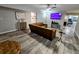 Comfortable living room with hardwood floors, a plush brown sofa, and a ceiling fan at 8341 41St N Ave, St Petersburg, FL 33709