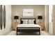 Modern bedroom features a dark-framed bed with stylish decor, and matching lamps on the bedside tables at 9583 Runaway Breeze Dr, Land O Lakes, FL 34637
